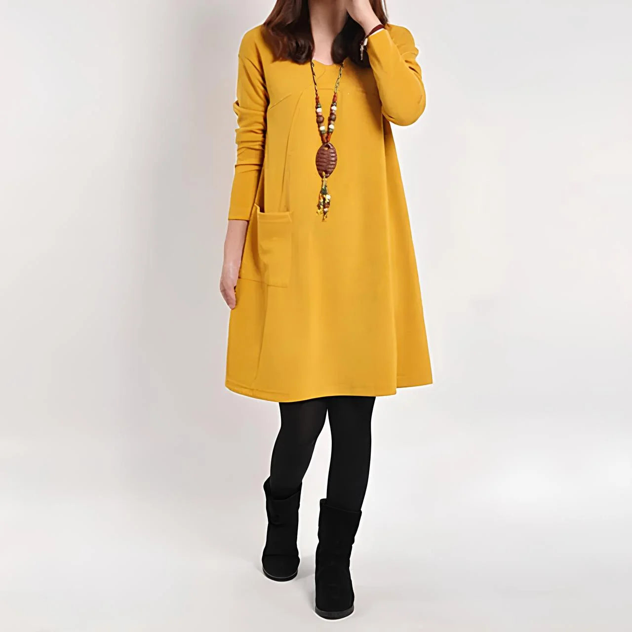 Yellow shift dress with functional pockets by Emeri. A versatile wardrobe staple made of soft, breathable fabric ideal for…