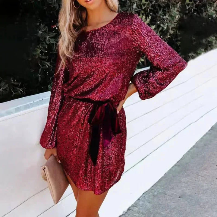 Red sequined dress for women with tie waist. Shimmery sequin fabric in an elegant design.