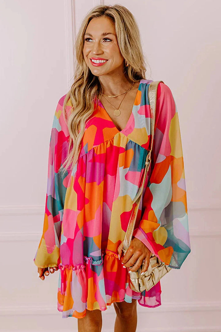 "Women's V-neck dress with vibrant bell sleeves, bohemian-style pattern, and flowing silhouette by Estefani"