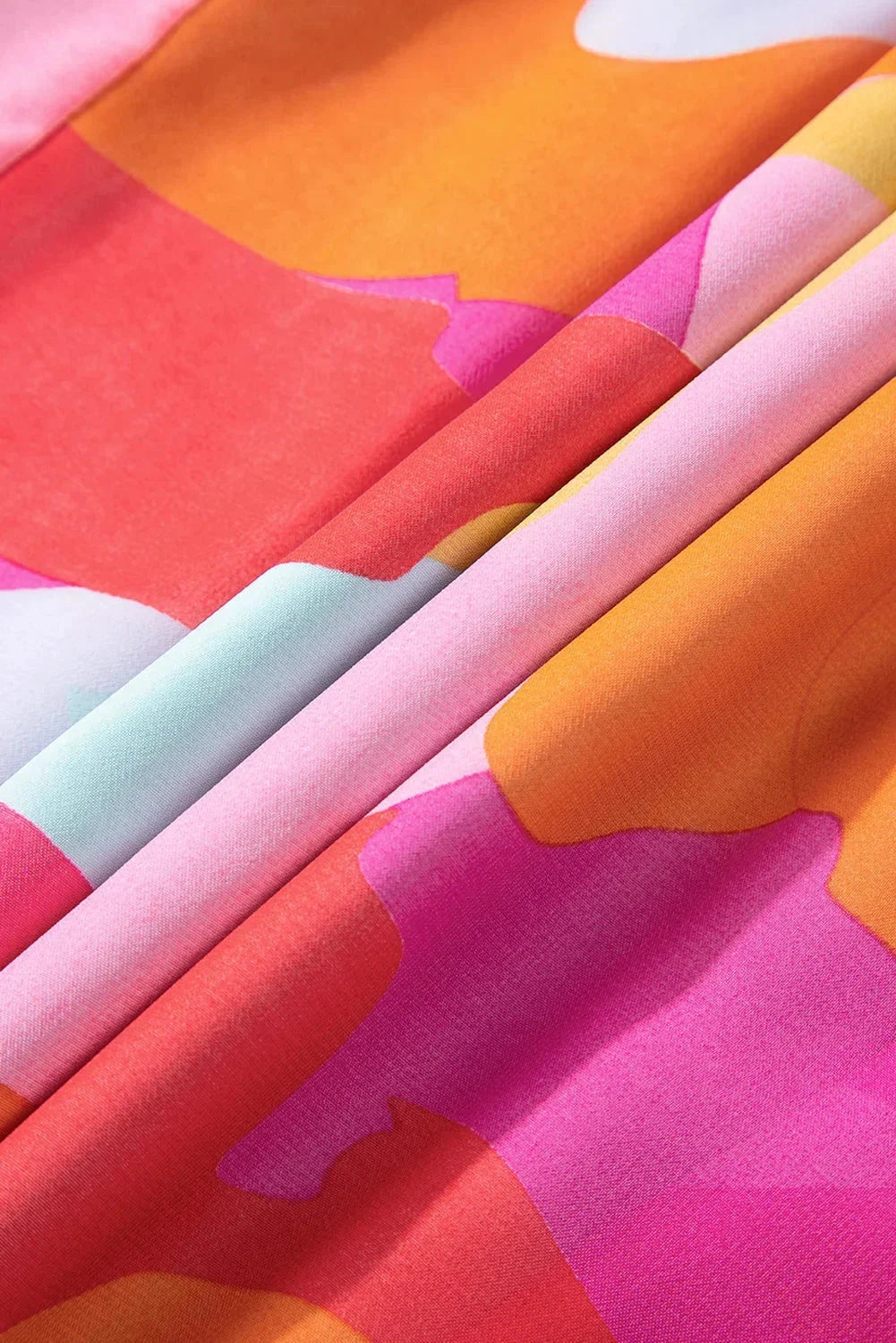"Vibrant bell-sleeve V-neck dress for women in colorful pattern, perfect for any occasion."