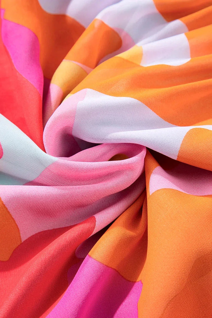 "Estefani women's colorful bell-sleeve V-neck dress in vibrant hues, flowy design, perfect for a casual chic look."