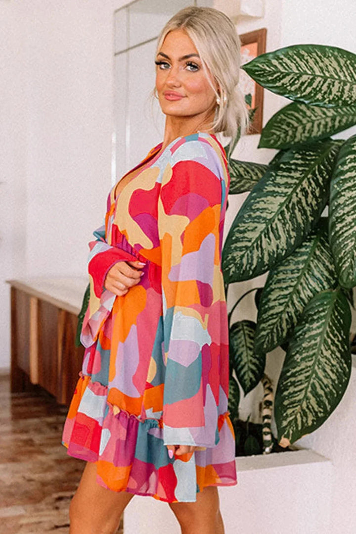 "Estefani Women's V-neck dress, showcasing vibrant bell sleeves and colorful design, perfect for a fun and stylish look."