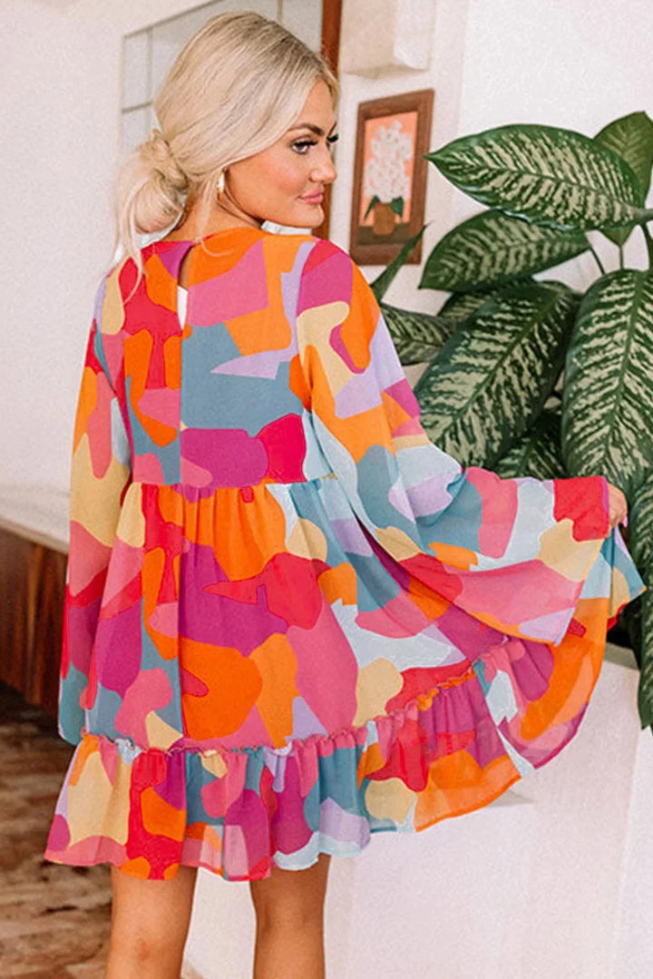 "Estefani women's dress with vibrant bell sleeves and V-neck, perfect for a stylish spring look."