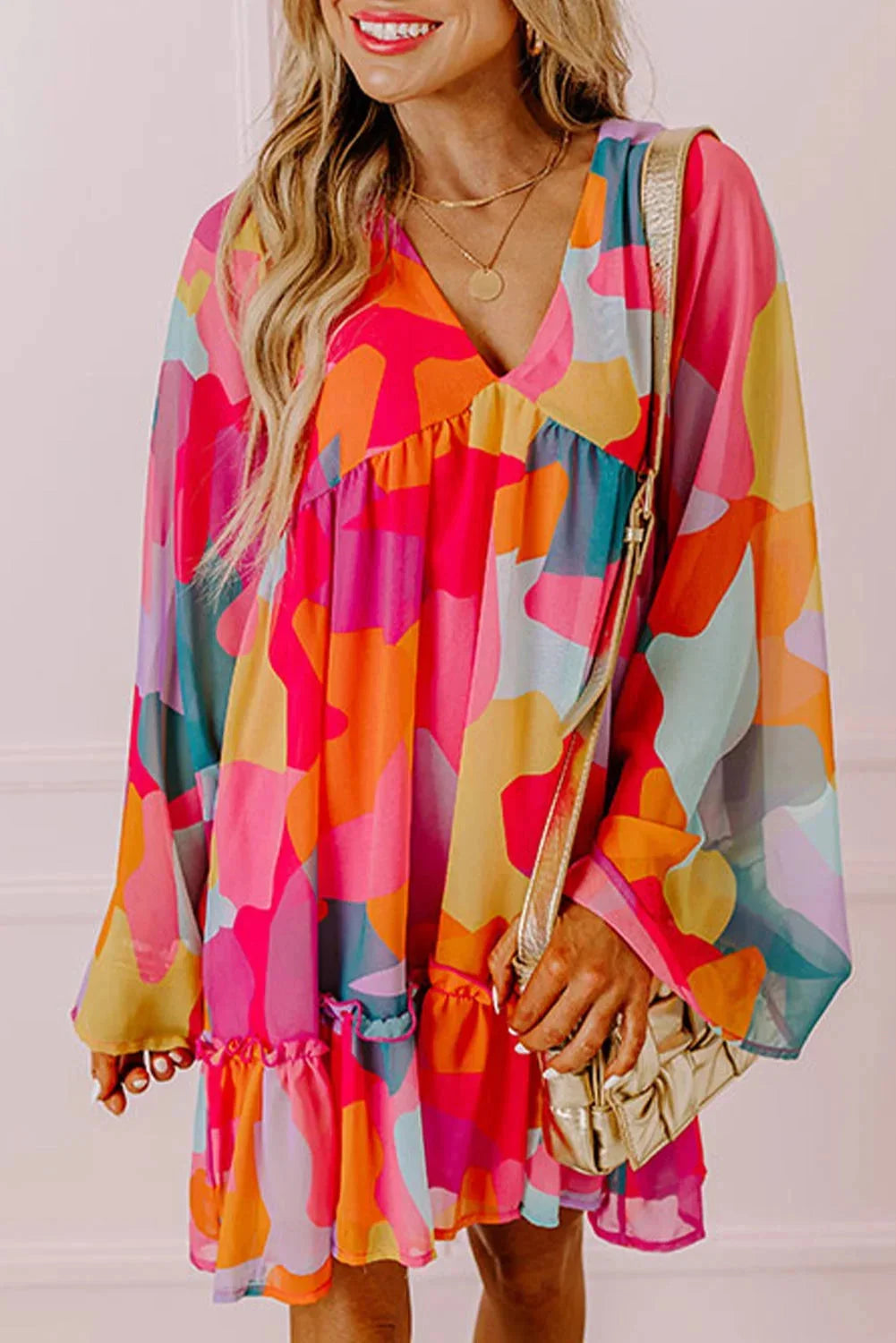 "Vibrant women's V-neck dress with colorful bell sleeves, ideal for casual wear or special occasions, made of soft and…