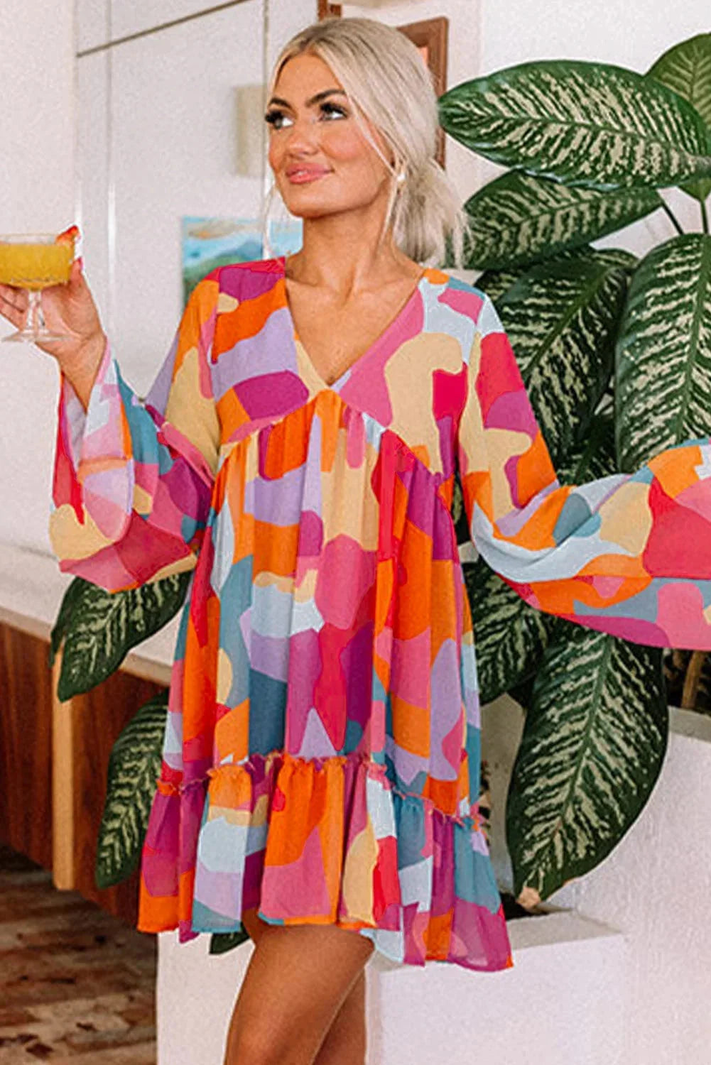 "Estefani women's dress with colorful bell sleeves, V-neck design, and soft comfortable fabric for casual or formal wear."