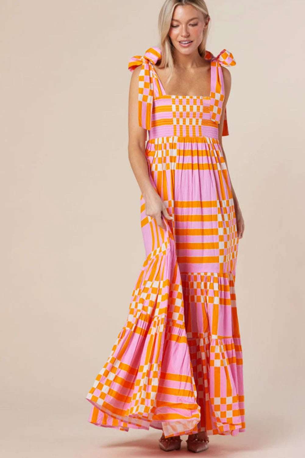 Pink orange gingham smocked maxi dress in a soft, lightweight fabric with a stylish design perfect for casual chic summer…