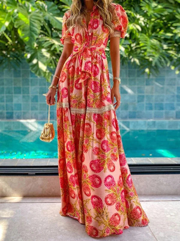 "Coral pink maxi dress with floral print design, perfect for a summer day out."