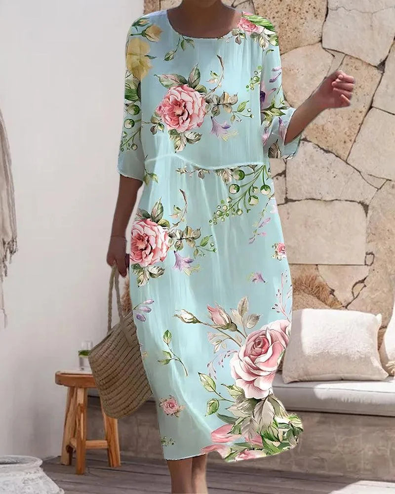 "Floral print midi beach dress made of lightweight fabric with a relaxed fit and adjustable straps for a breezy summer look."