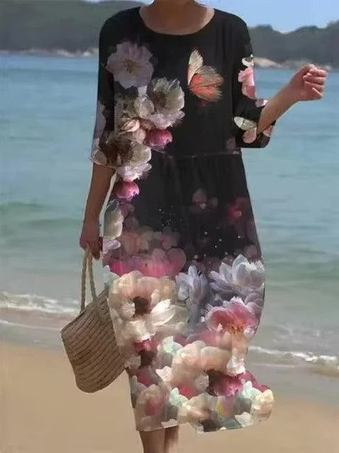 Black floral print midi beach dress with adjustable straps and a flowy silhouette. Perfect for a day at the beach or a…