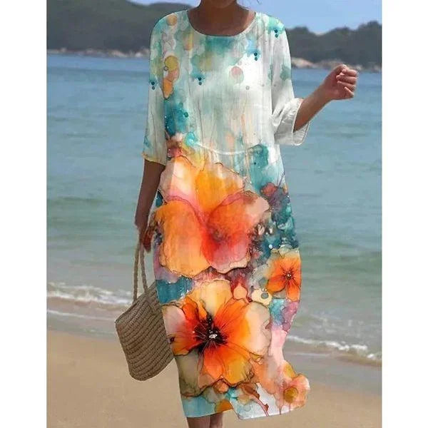 Floral print midi beach dress featuring a vibrant flower pattern, lightweight fabric, and a relaxed fit perfect for summer…