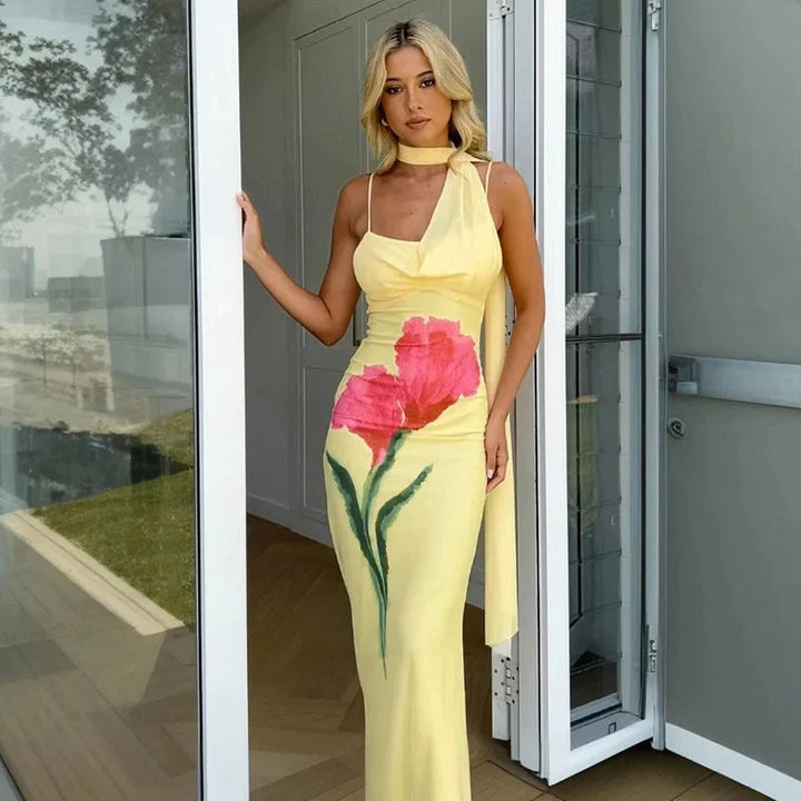 Yellow floral maxi dress with halter top for women, showcasing a vibrant floral pattern on a flowy silhouette, perfect for…