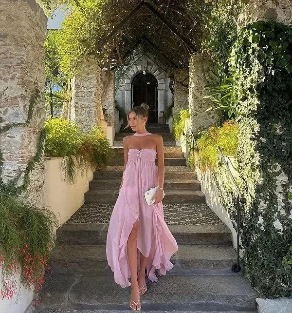 Strapless maxi dress in deep navy with cascading ruffles and a relaxed fit, perfect for summer events.