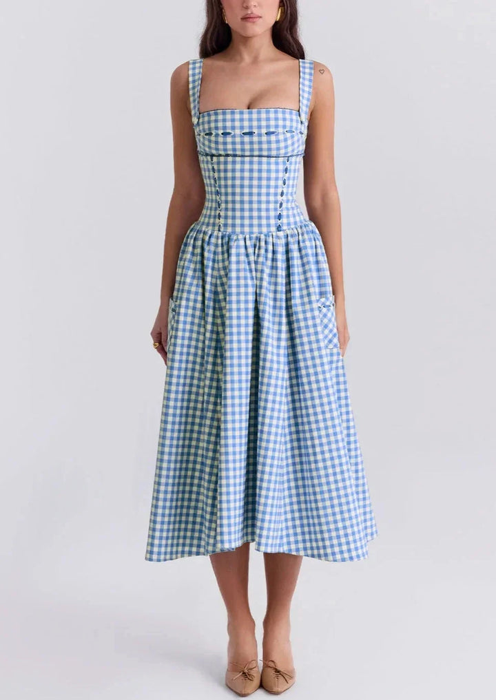 Off-shoulder mid-length dress in blue gingham pattern. Made of breezy Georgette fabric perfect for summer days.
