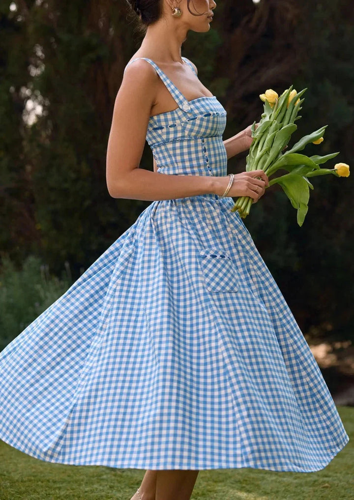 Blue gingham off-shoulder mid-length dress for women made of georgette fabric with a stylish design and trendy off-shoulder…