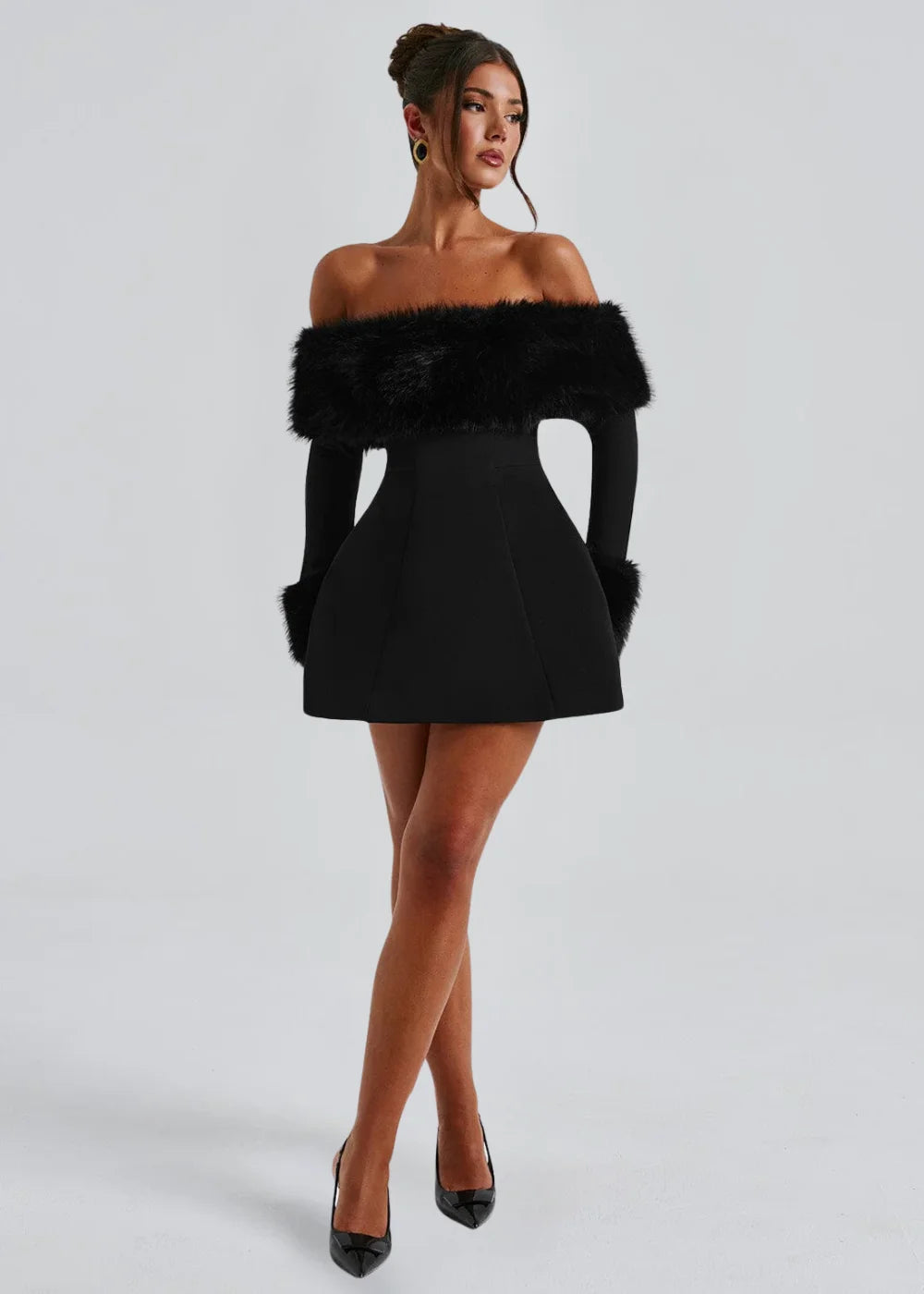 "Black mini dress with faux fur details, sleeveless, round neckline, perfect for winter evenings."