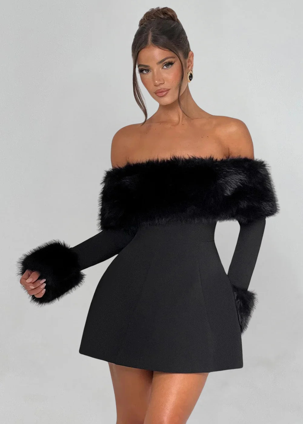 "Black mini dress featuring chic fur details, ideal for a stylish and cozy look. Perfect for a night out or special…