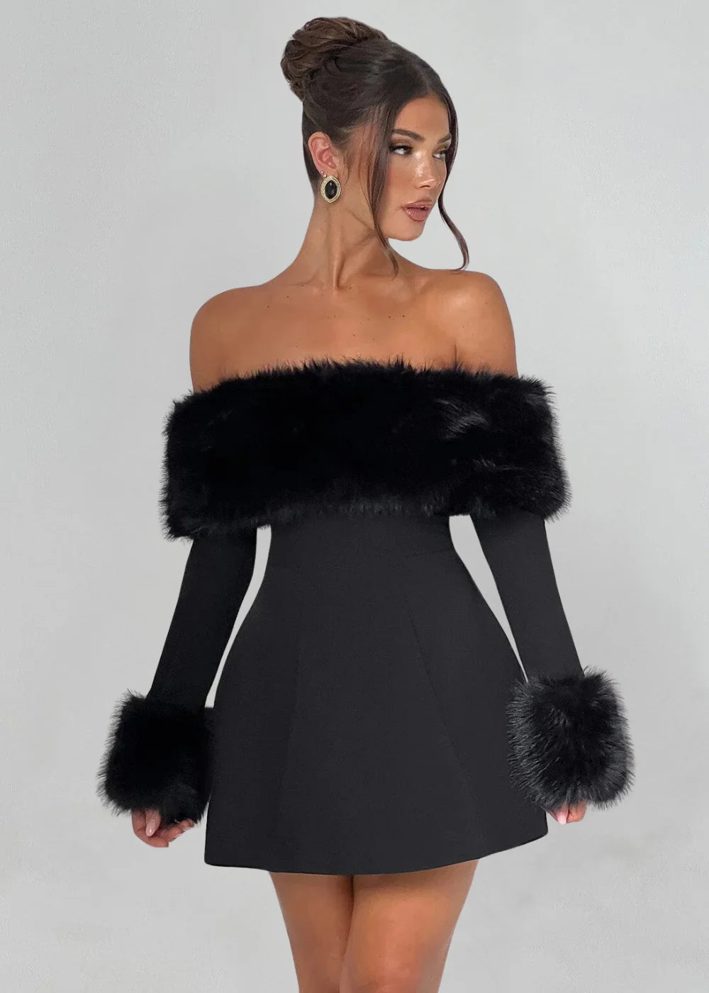 Black mini dress with plush fur details, perfect for winter outings.