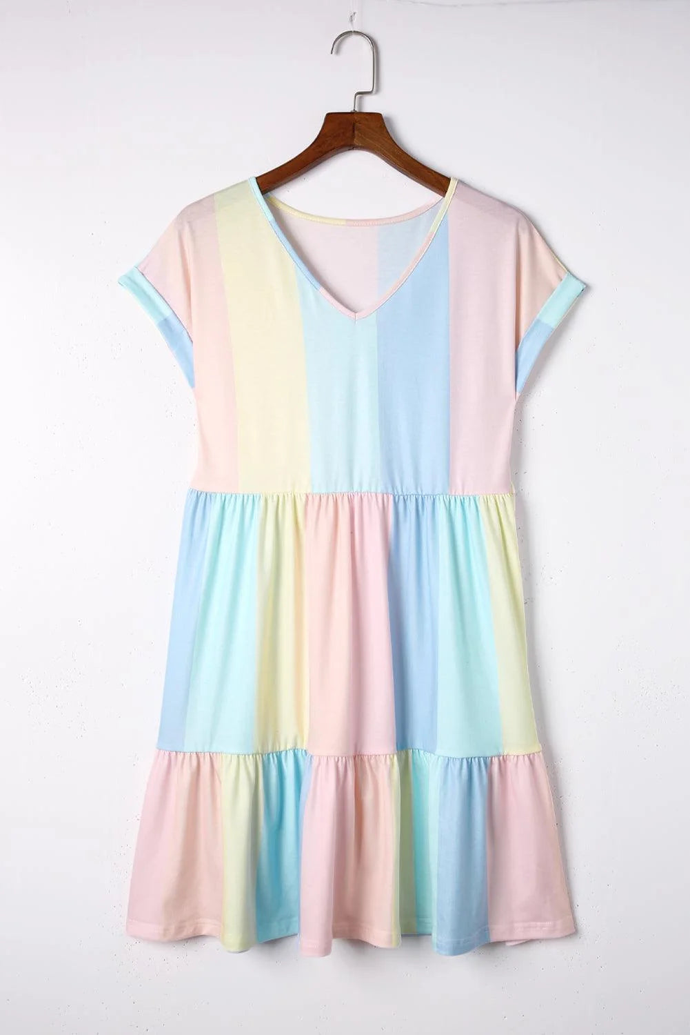 "Yellow pastel tiered dress with V-neck, flowy fabric, perfect for summer events"