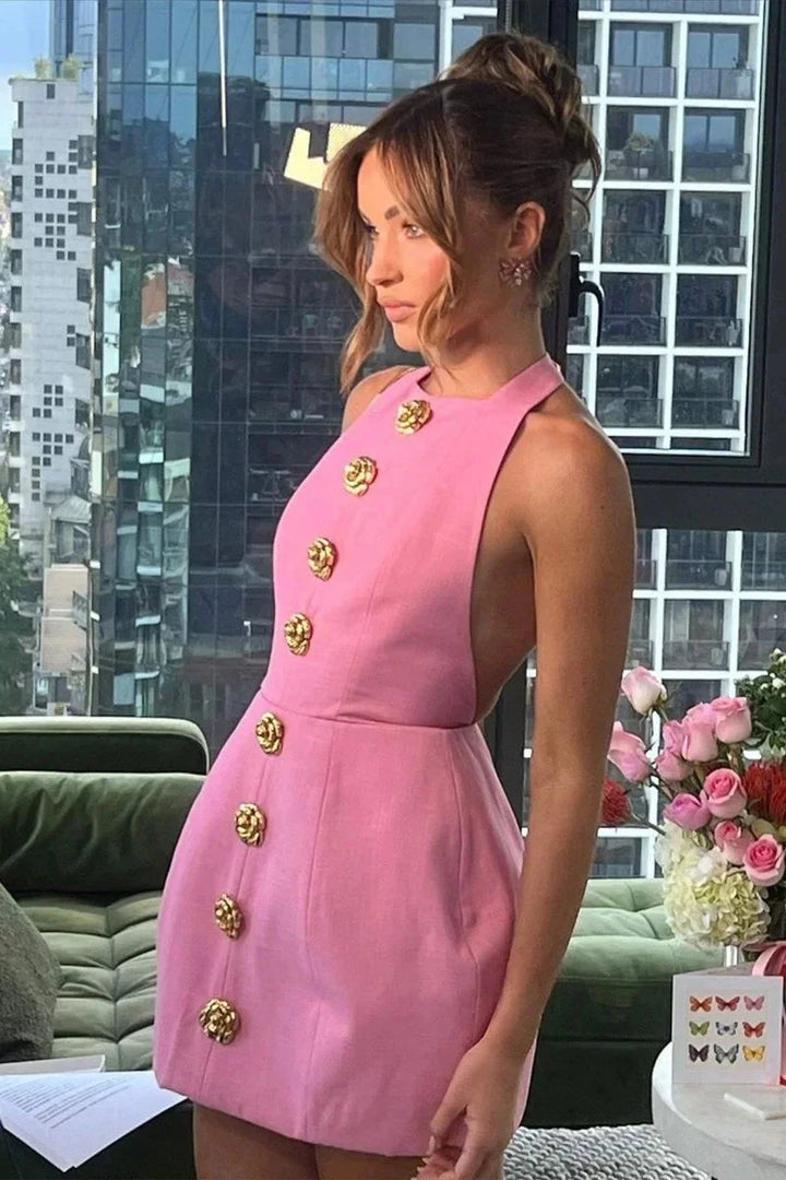 Women's halter dress with golden buttons, made of lightweight breathable fabric. Features a flattering fit and trendy design…
