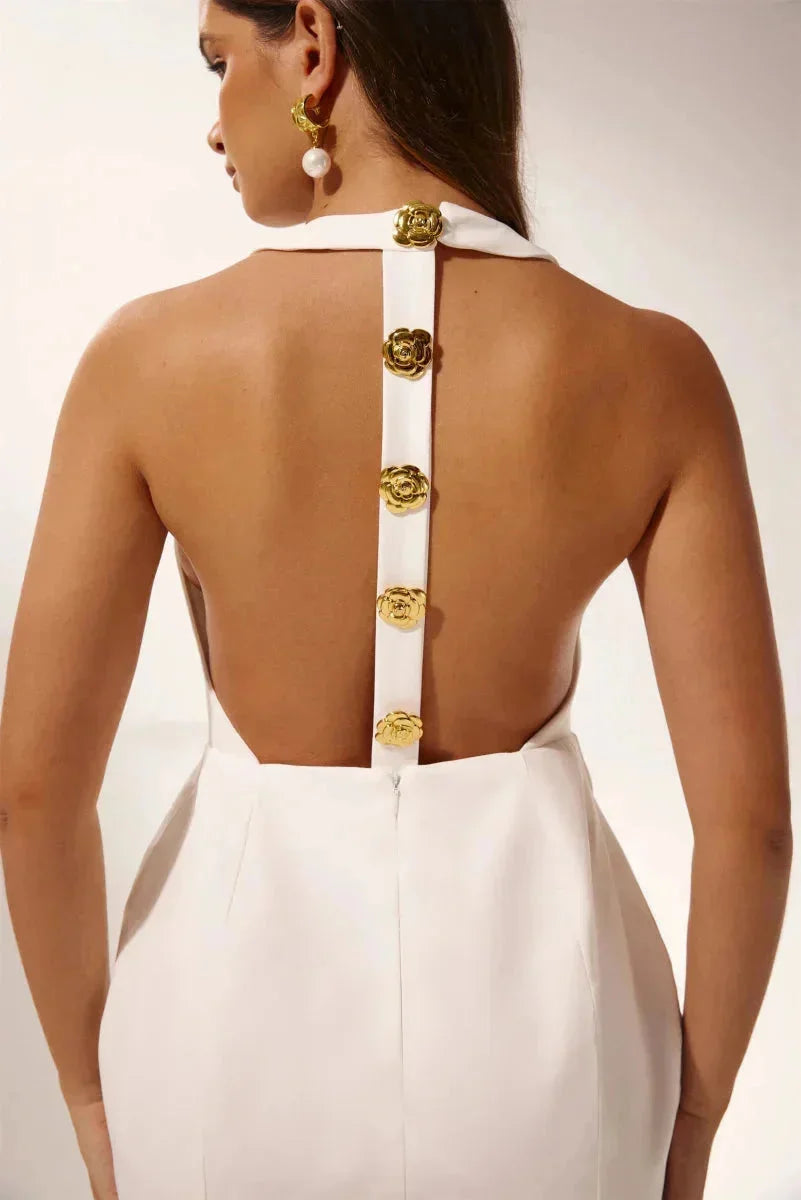 Women's halter dress in black with golden buttons, perfect for a casual yet stylish look at any event. Made of soft and…