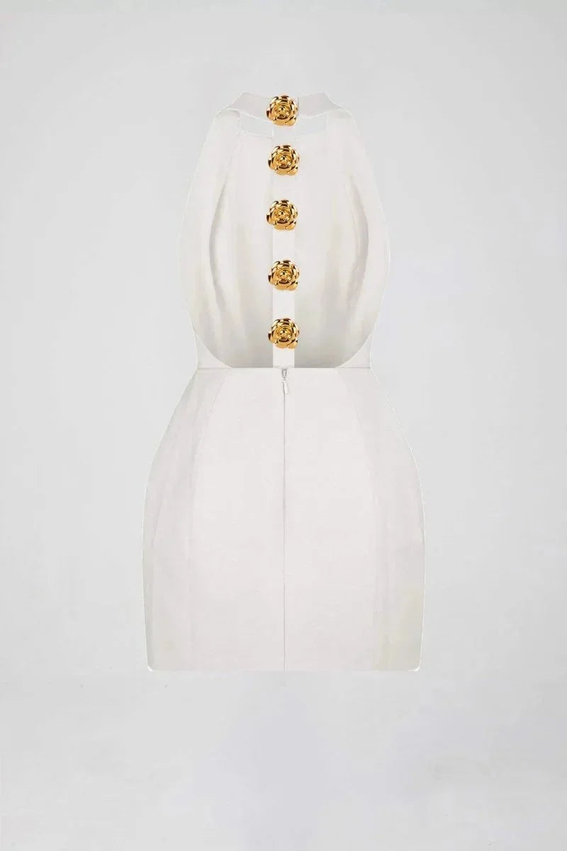 Black halter dress with striking golden buttons, perfect for a chic look.
