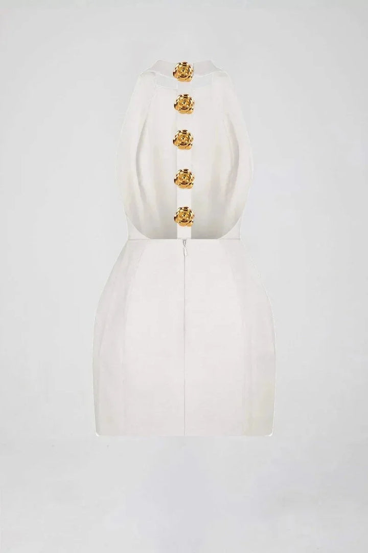 Black halter dress with striking golden buttons, perfect for a chic look.