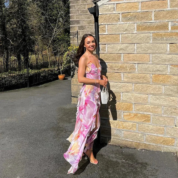 "Sleeveless maxi dress with pink floral print, perfect for summer days. Features a flowing silhouette and comfortable…