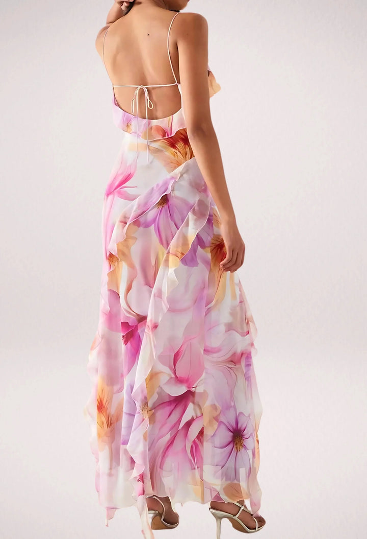 Sleeveless maxi dress in pink with floral print, ideal for a summer day out.