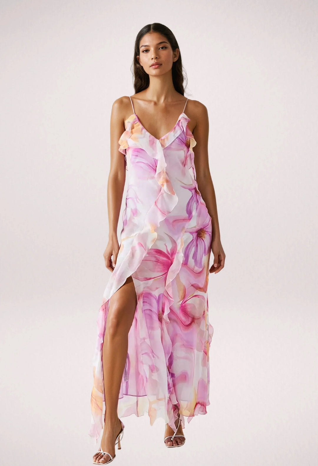 Sleeveless maxi dress with pink floral print, made from lightweight and breathable fabric, perfect for a casual summer day.