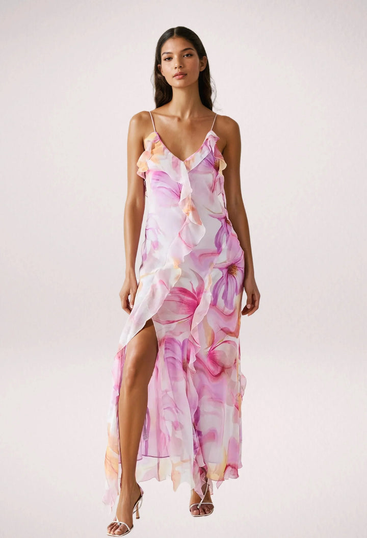 Sleeveless maxi dress with pink floral print, made from lightweight and breathable fabric, perfect for a casual summer day.