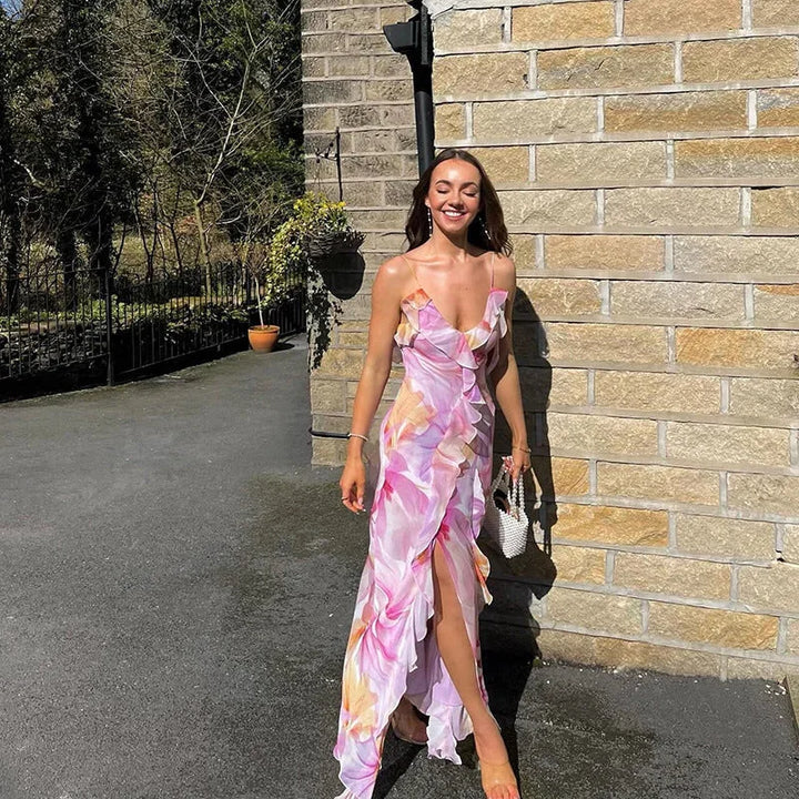 Sleeveless maxi dress with pink floral print, made of lightweight fabric, perfect for a summer day out.