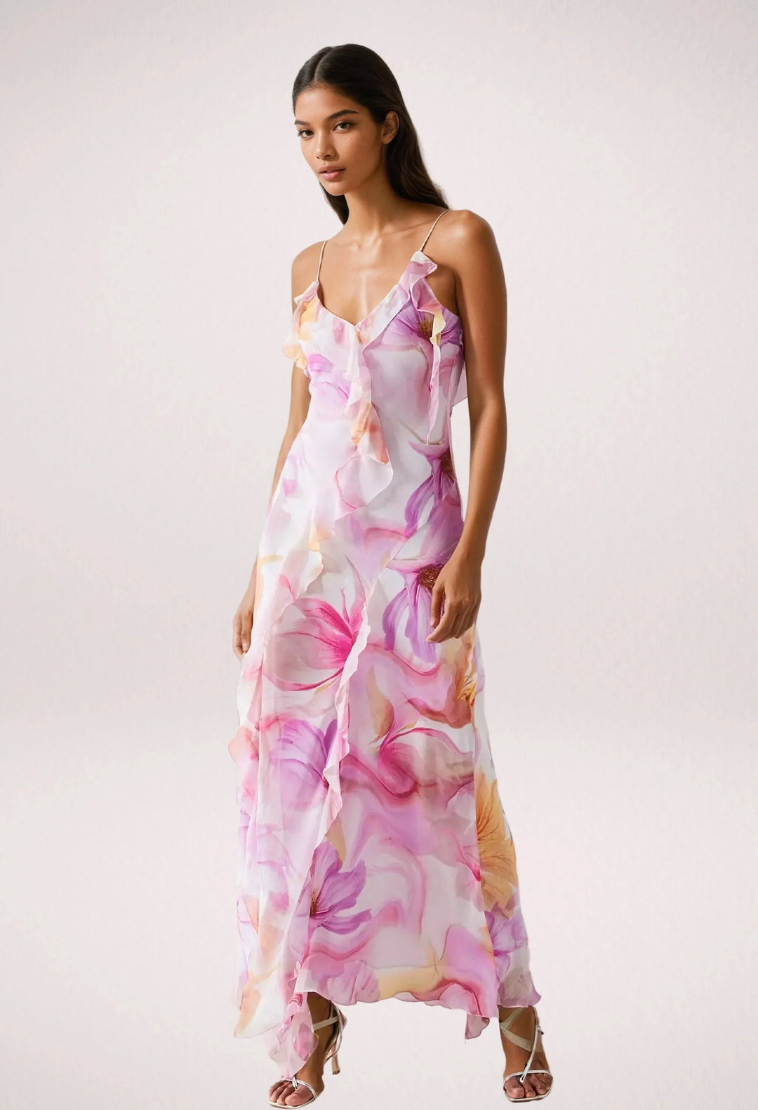 "Sleeveless maxi dress featuring pink floral print, perfect for summer. Lightweight and breathable fabric."