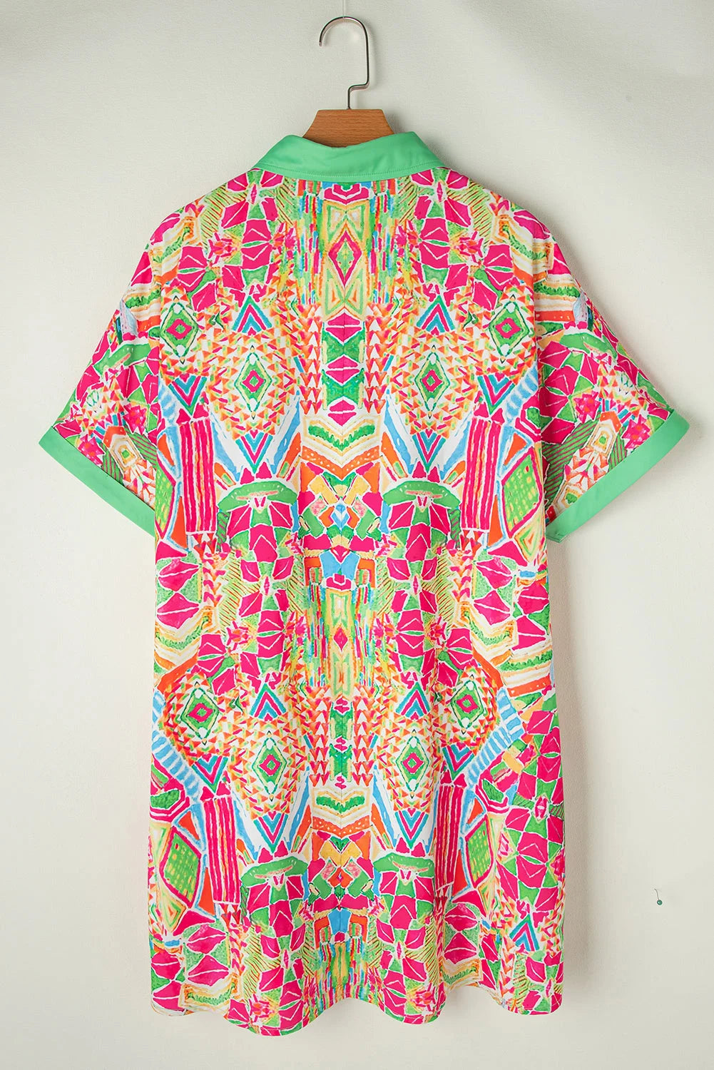 "Harlym shirt dress featuring colorful geometric patterns, made from lightweight and breathable fabric."