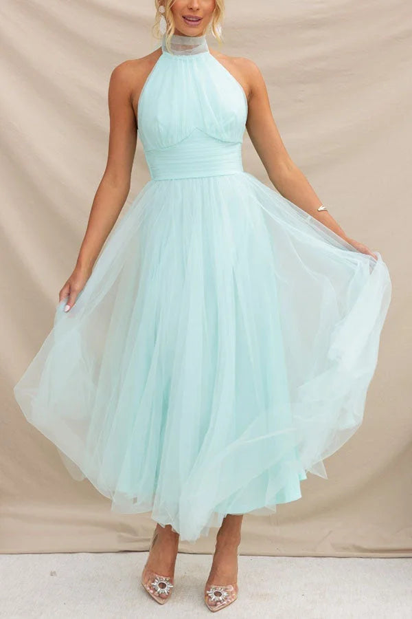 Light blue flowy pleated mid-length dress made of airy chiffon. Perfect for a breezy, chic look on any occasion.