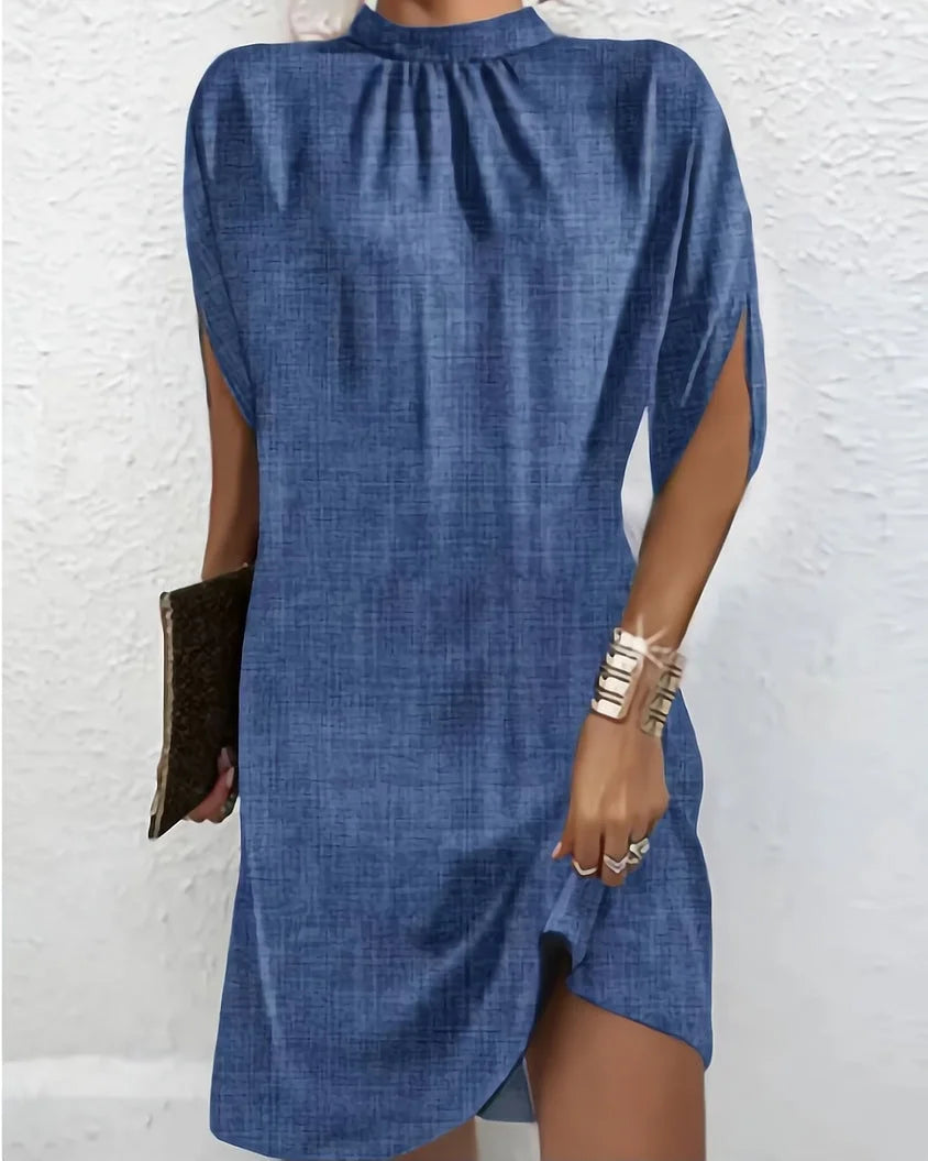 Blue Icelyn mini dress with elegant batwing sleeves, crafted from soft, flowy fabric. Perfect for a chic and effortless look.