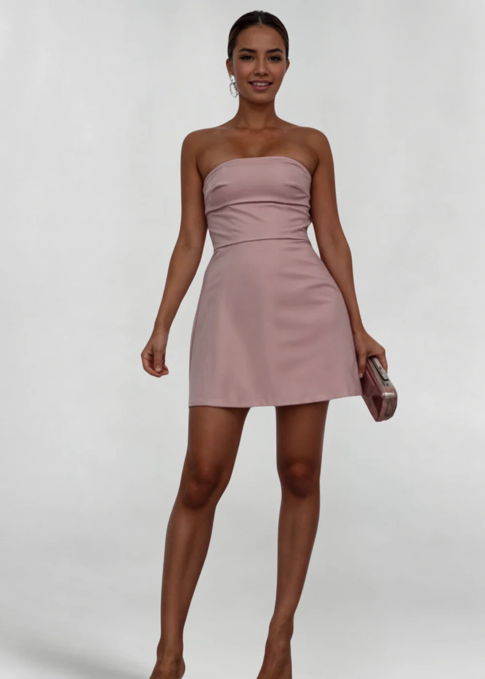 Strapless mini dress in blush with matching clutch, draped detail on bodice.