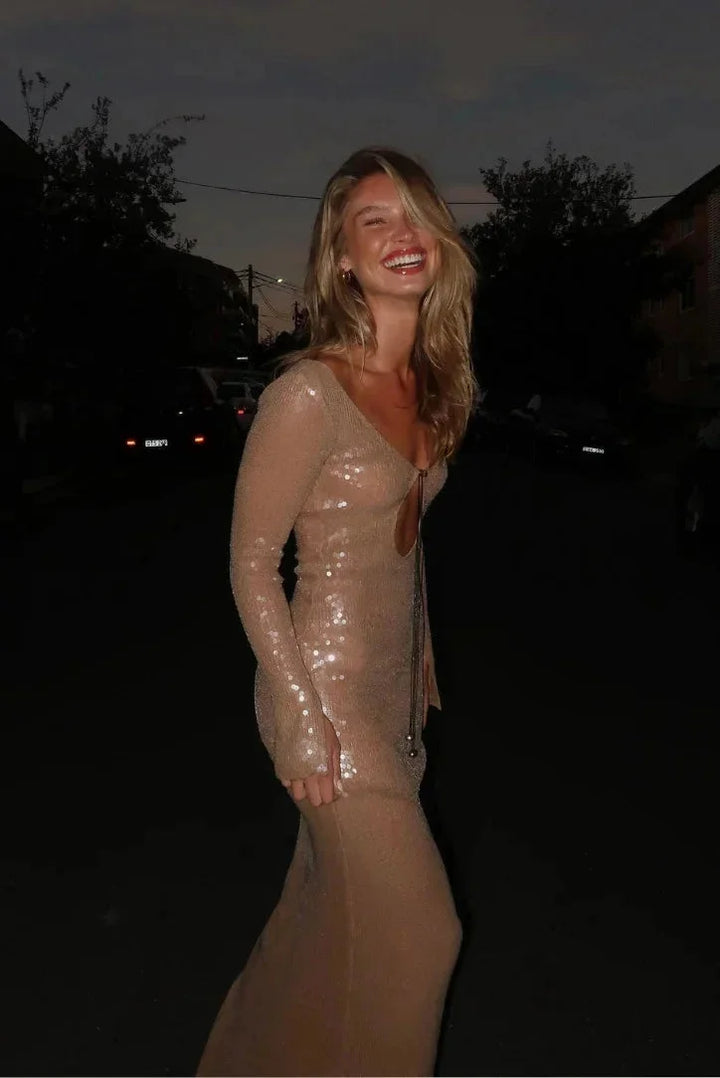 Beige sequined dress with deep V-neck, perfect for a glamorous evening out on the island.