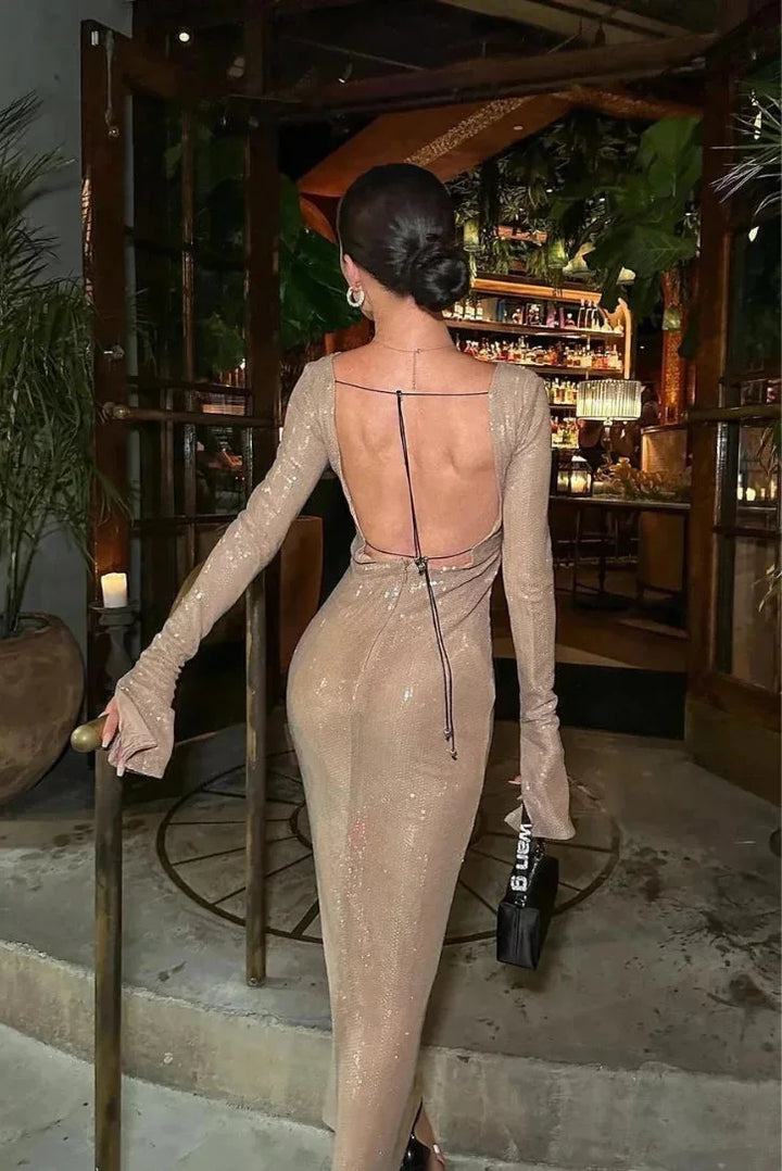 Beige sequined dress with deep V-neck, perfect for a night out or special occasion, featuring a stunning island-inspired…