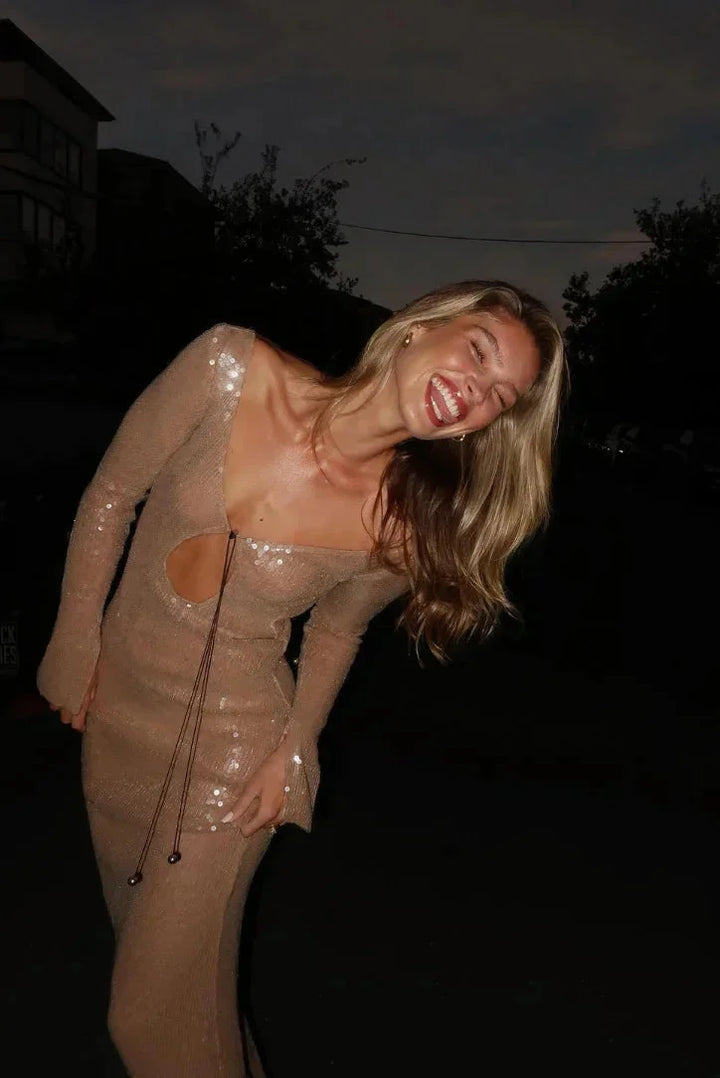 Beige sequined dress with deep V-neck, perfect for special occasions, featuring island-inspired design.