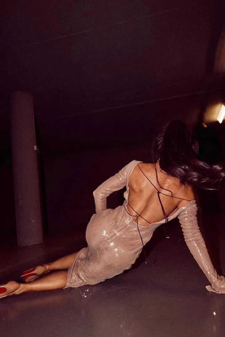 Beige sequined dress with deep V-neck, perfect for a glamorous night out on the island.