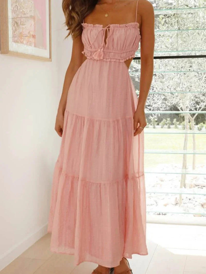 Pink maxi dress for women with adjustable spaghetti straps. Made with soft and breathable fabric, perfect for sunny days.