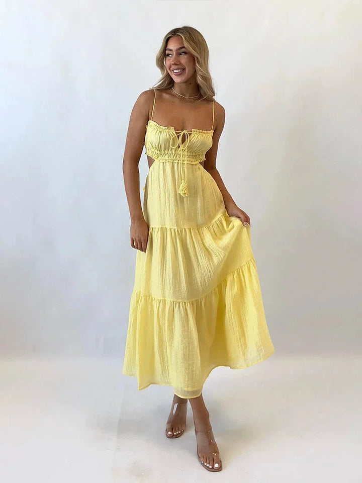 Yellow sleeveless maxi dress with adjustable spaghetti straps, perfect for sunny days. Made of lightweight, flowy fabric for…