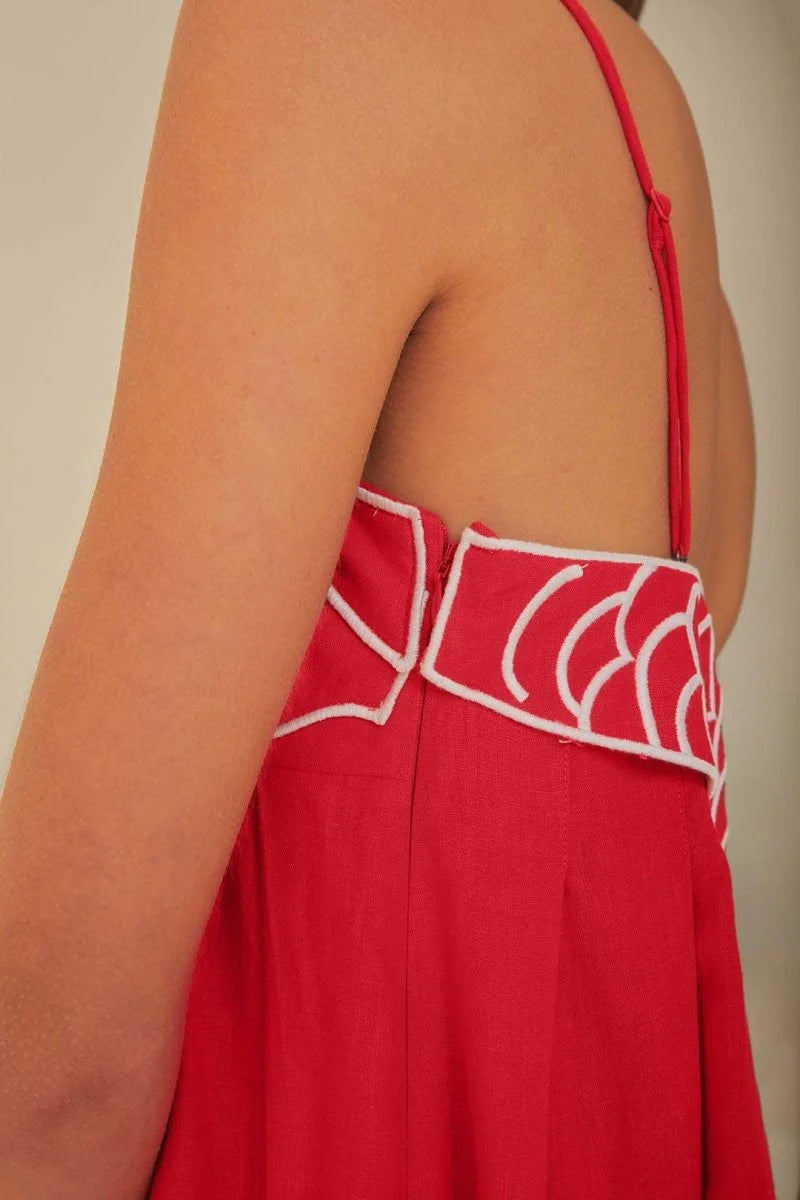 Red cotton maxi dress featuring goldfish embroidery, perfect for a casual and stylish look.