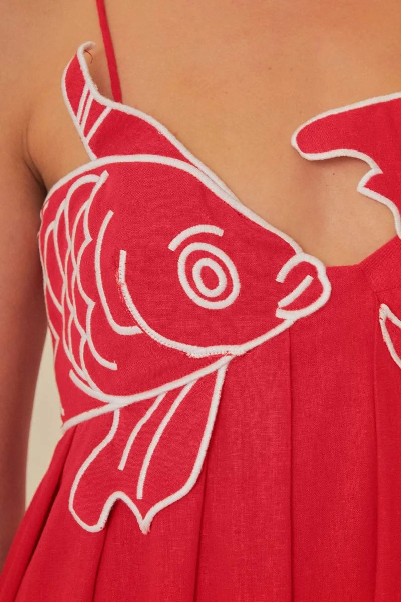 Red cotton maxi dress featuring intricate goldfish embroidery, perfect for a casual yet stylish look.