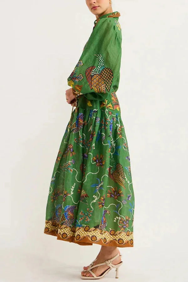 Women's green bird print button-up midi dress showcasing a playful bird pattern on a comfortable and stylish silhouette.