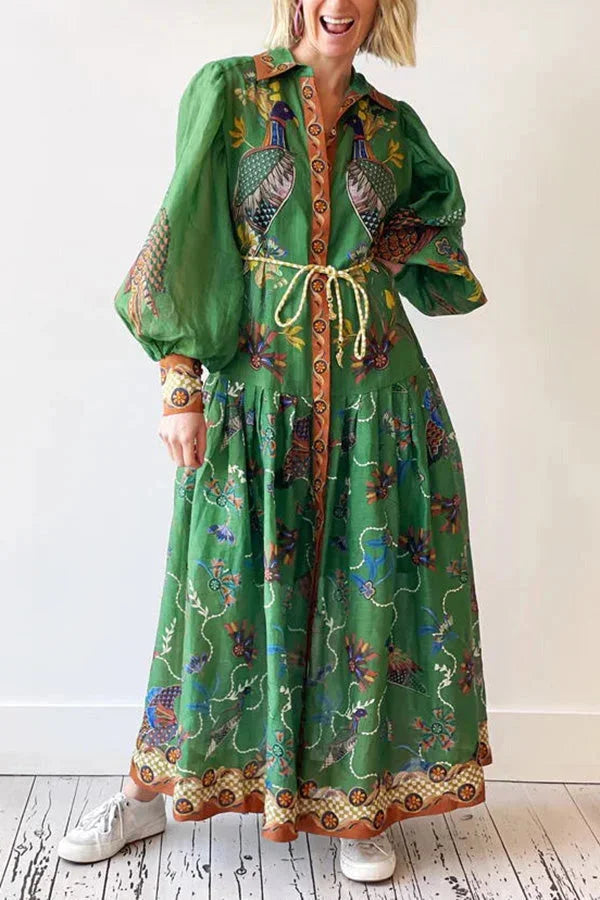 "Green bird print midi dress for women with button-up front, featuring a charming avian motif on lightweight fabric."