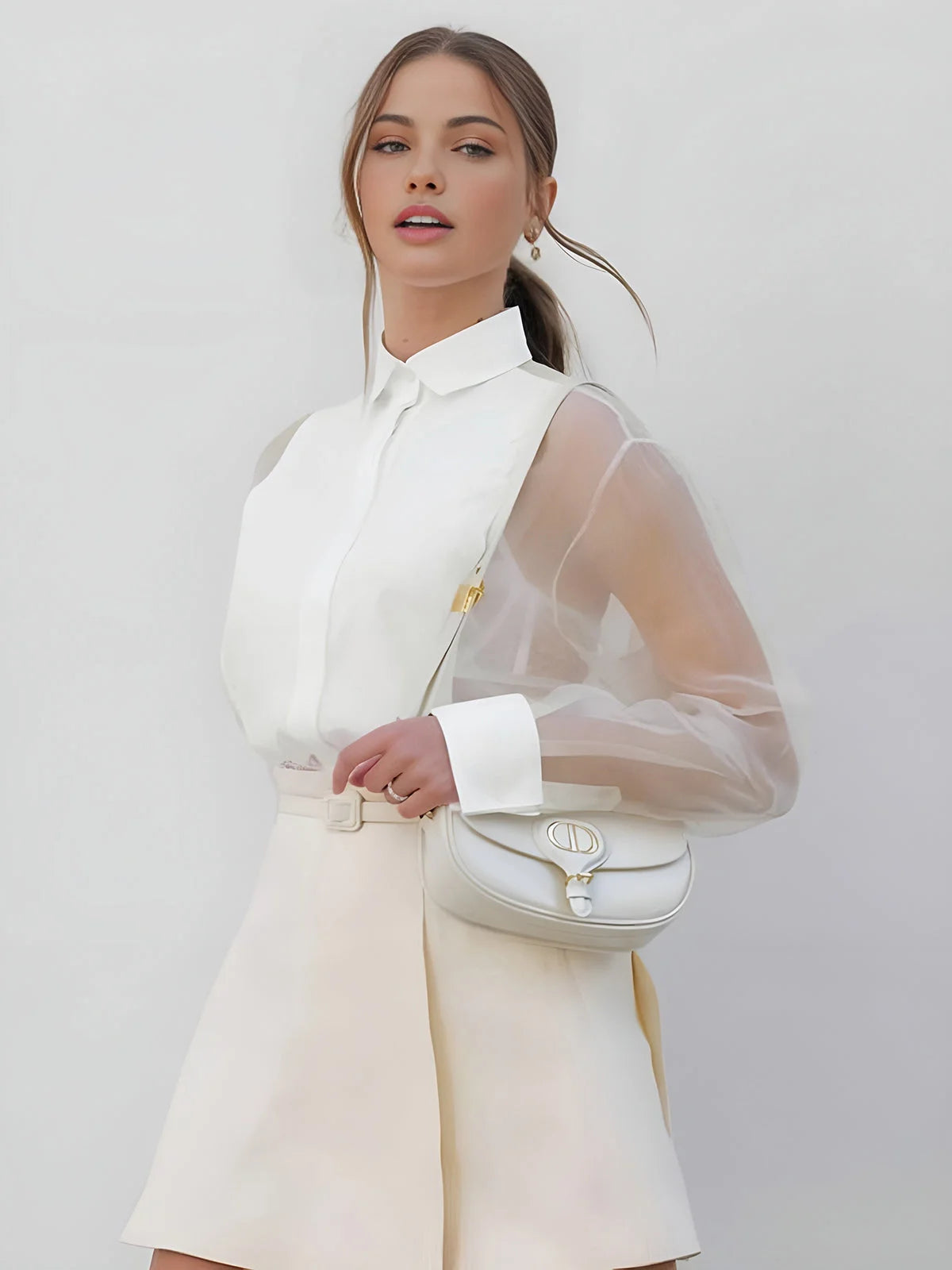 "White shirt dress with sheer sleeves, perfect for a chic and elegant look."