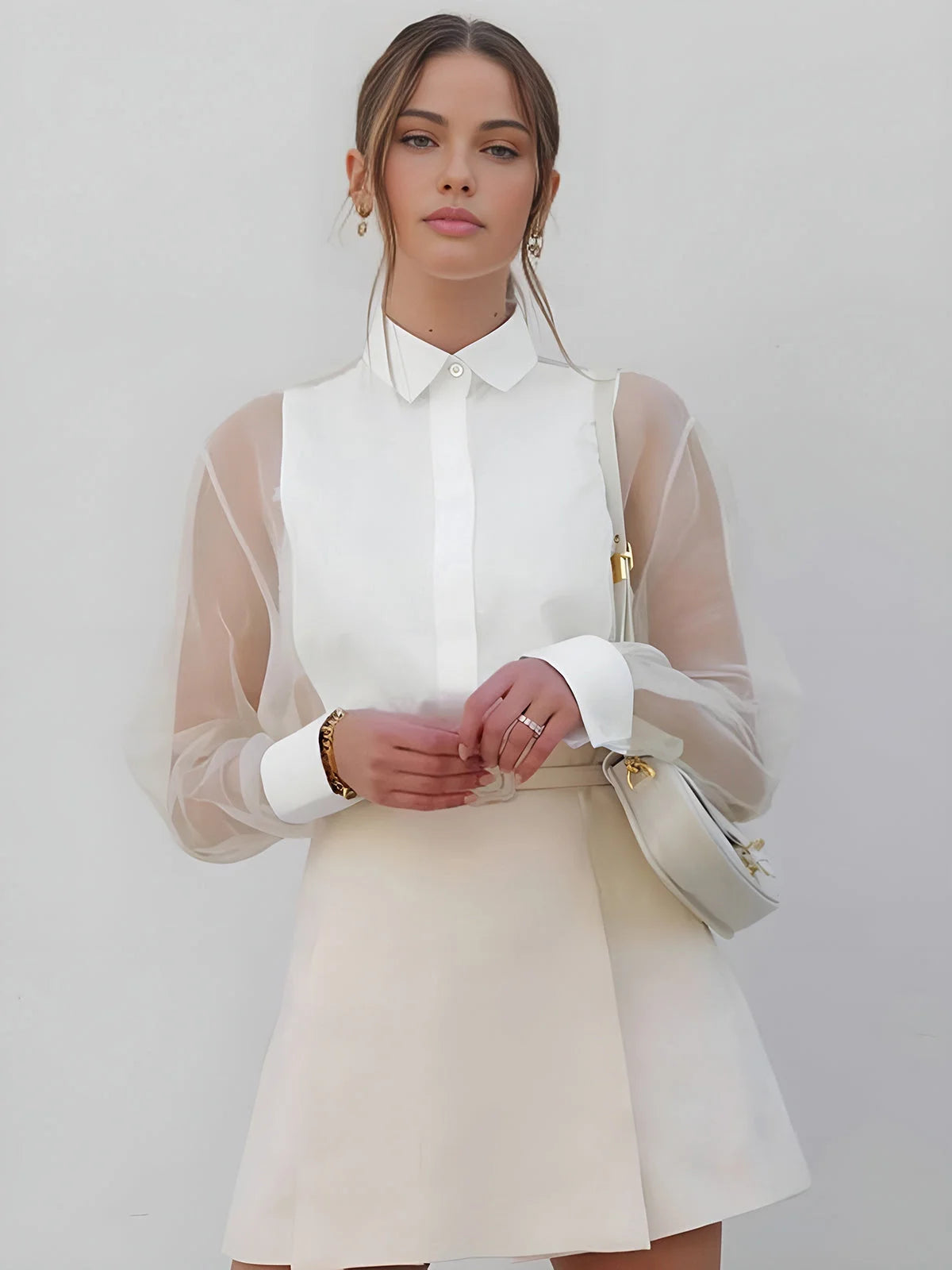 White shirt dress featuring sheer sleeves, a timeless design made with high-quality fabric.