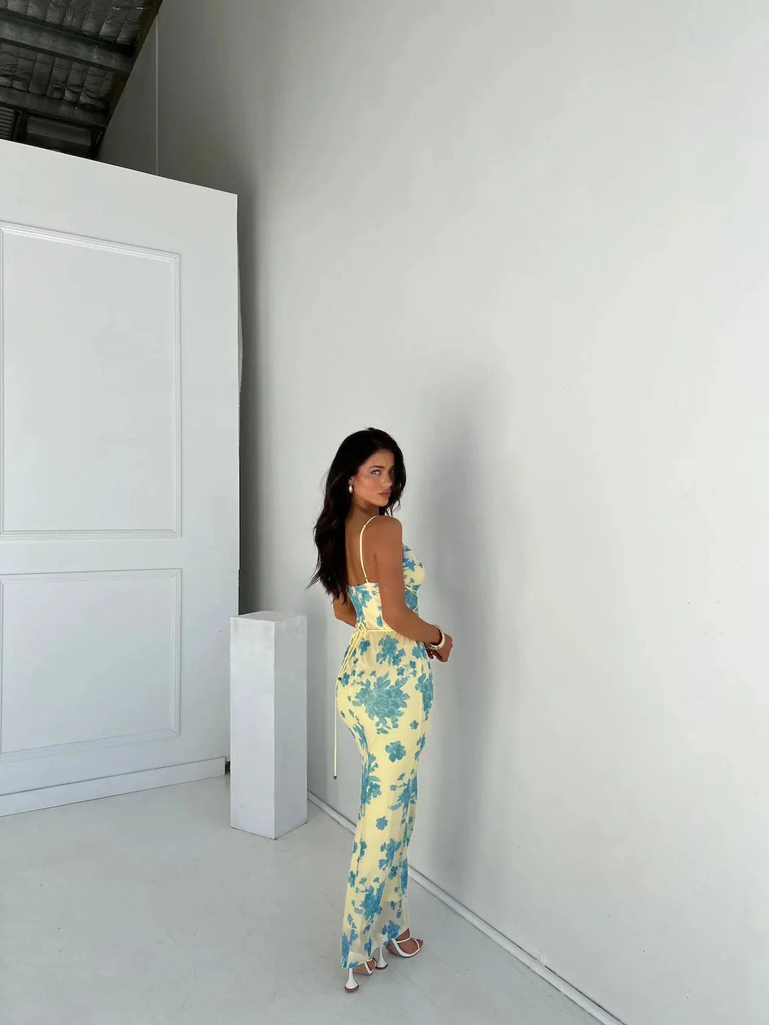 Yellow floral slim-fit maxi dress for women by Jaslynn with a beautiful floral pattern, slim-fit design, and vibrant yellow…