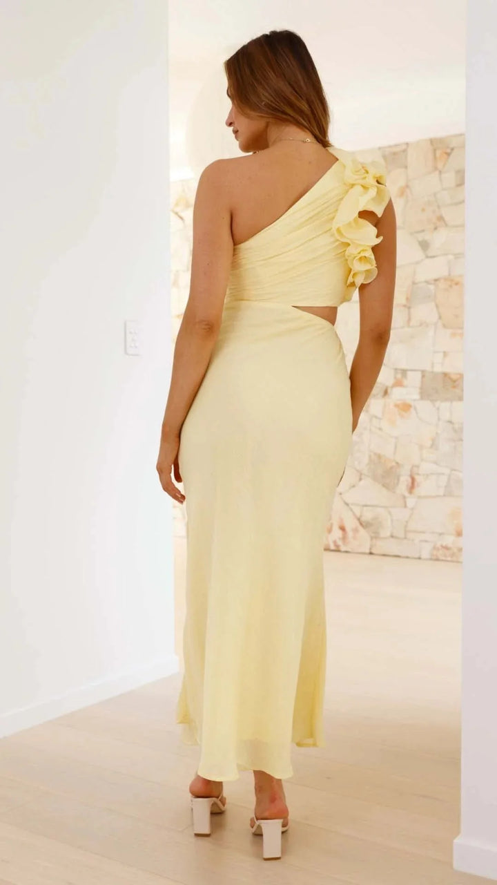 Yellow maxi dress for women, featuring floral shoulder design on lightweight fabric. Bright and elegant option for any…
